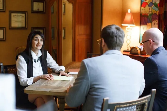 Leslie working with clients at the Leslie Gattas & Associates office in Memphis, TN.